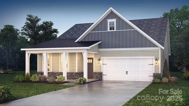 a view of a house with a yard and potted plants