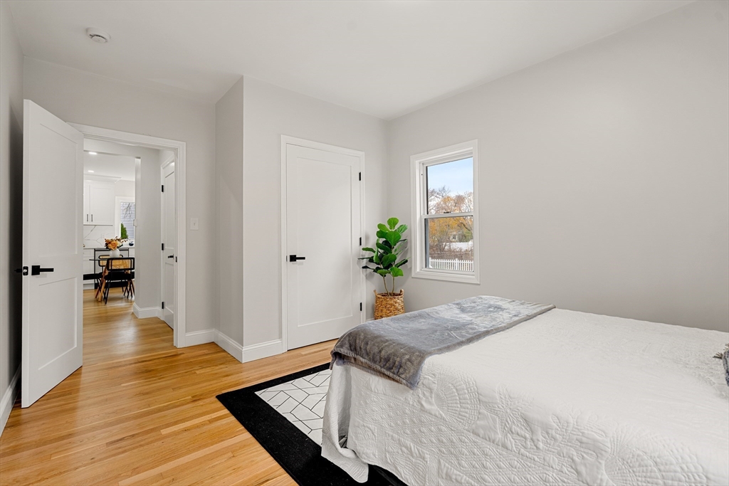 7 Davis Street Saugus, MA 01906 - Photo 17 of 42 a bedroom with a bed and wooden floor
