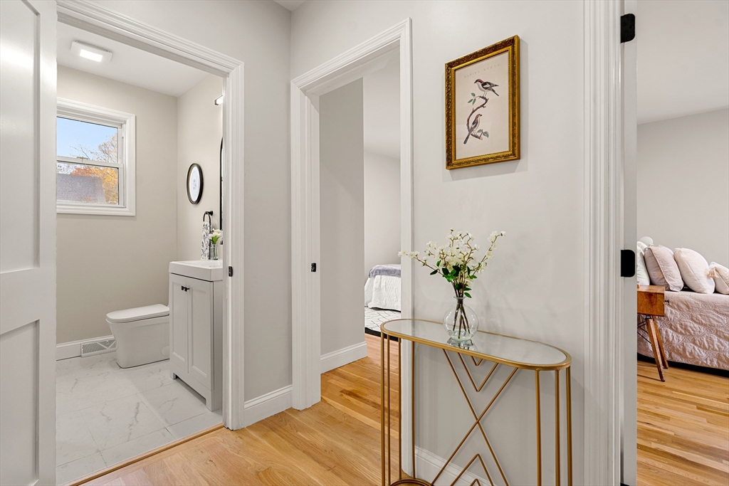 7 Davis Street Saugus, MA 01906 - Photo 20 of 42 a view of a hallway with wooden floor and furniture