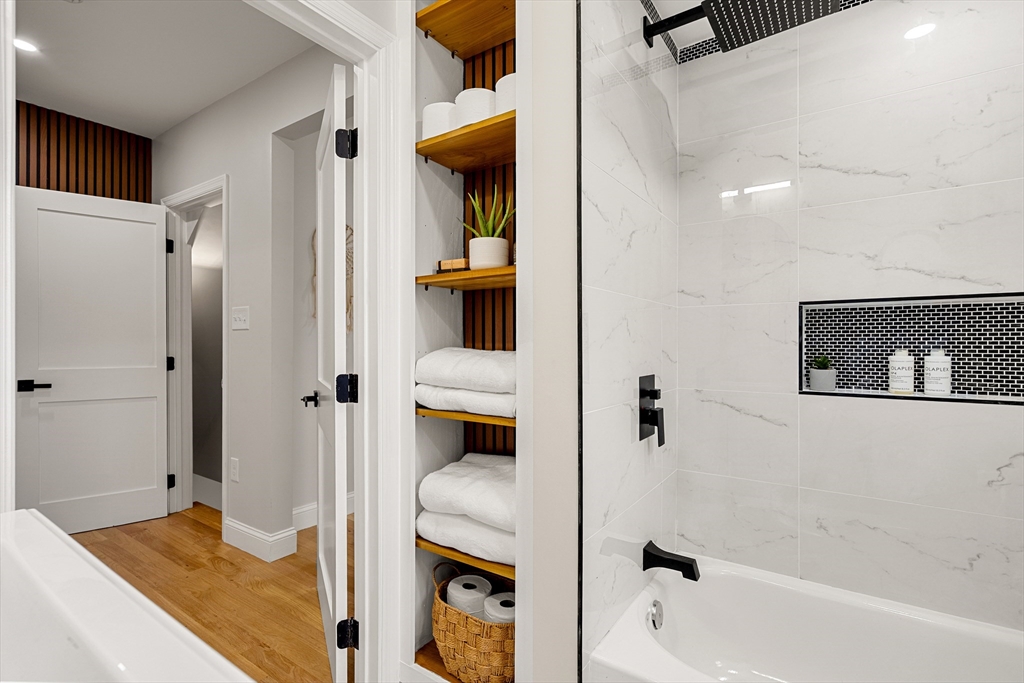 7 Davis Street Saugus, MA 01906 - Photo 22 of 42 a bathroom with a bathtub and shower