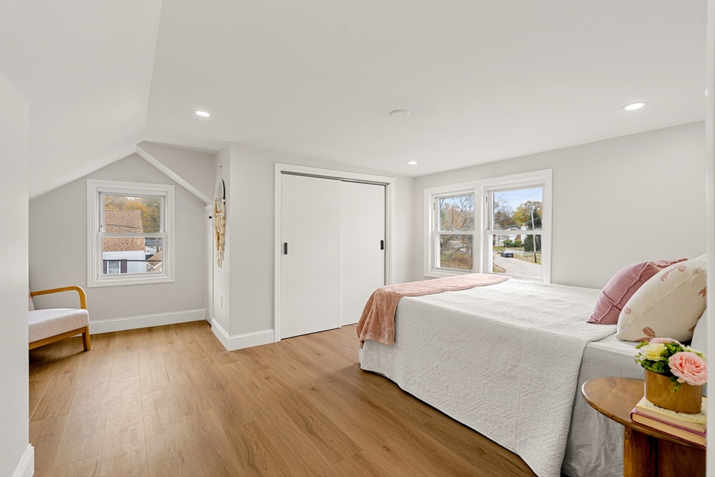 7 Davis Street Saugus, MA 01906 - Photo 23 of 42 a bedroom with a bed and wooden floor