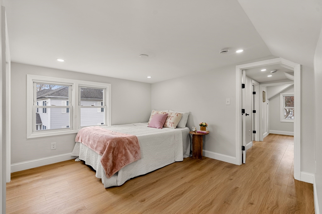 7 Davis Street Saugus, MA 01906 - Photo 24 of 42 a spacious bedroom with a bed and wooden floor