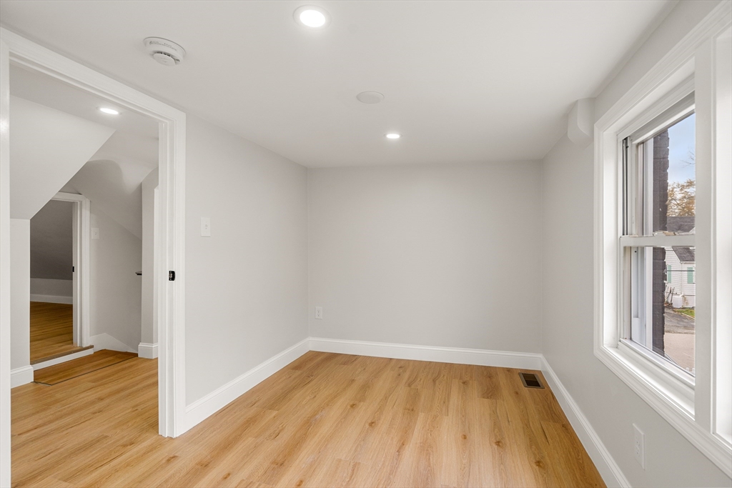 7 Davis Street Saugus, MA 01906 - Photo 27 of 42 wooden floor in an empty room with a window