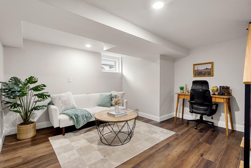 7 Davis Street Saugus, MA 01906 - Photo 29 of 42 a living room with furniture and a wooden floor