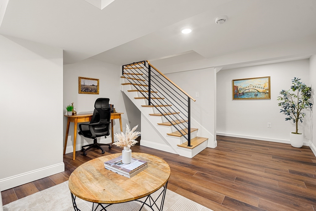7 Davis Street Saugus, MA 01906 - Photo 30 of 42 a view of a workspace with furniture and wooden floor