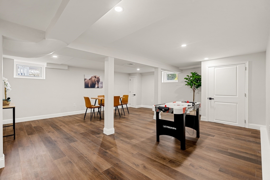 7 Davis Street Saugus, MA 01906 - Photo 31 of 42 a living room with furniture and a wooden floor