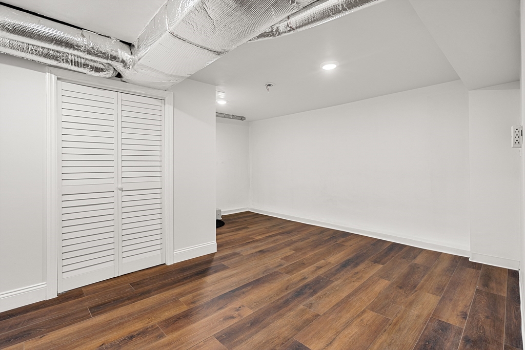 7 Davis Street Saugus, MA 01906 - Photo 34 of 42 an empty room with wooden floor and windows