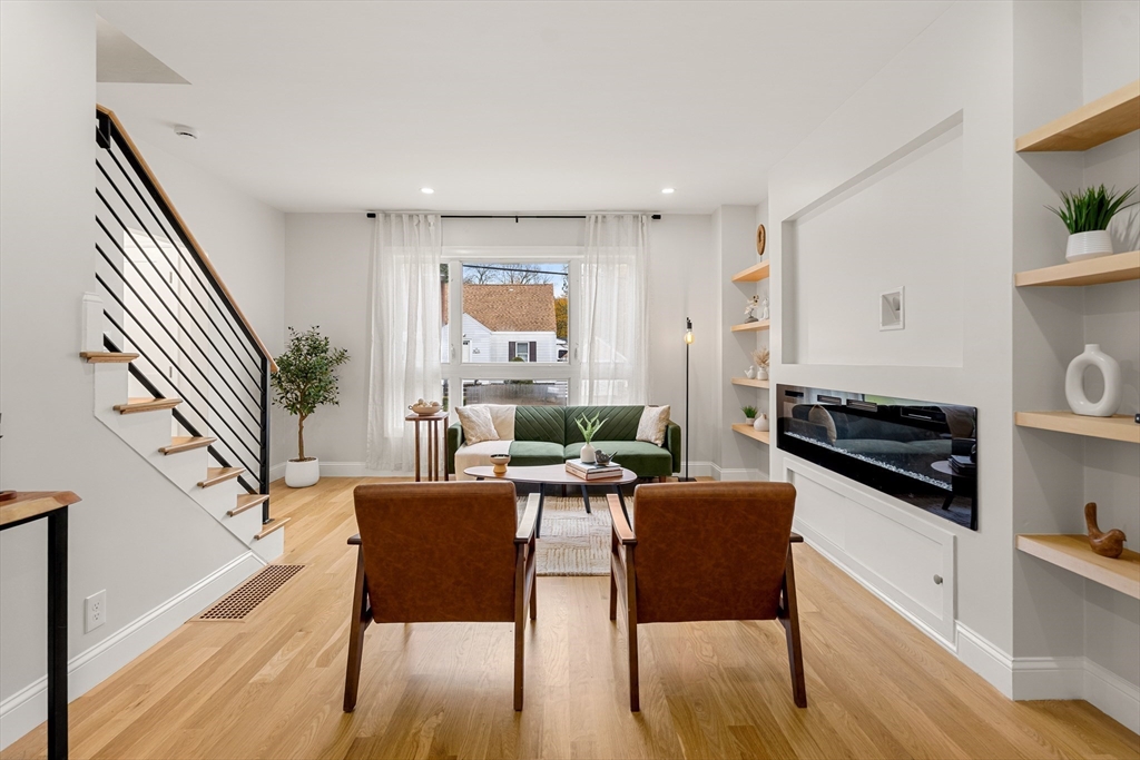 7 Davis Street Saugus, MA 01906 - Photo 10 of 42 a living room with furniture a table and wooden floor