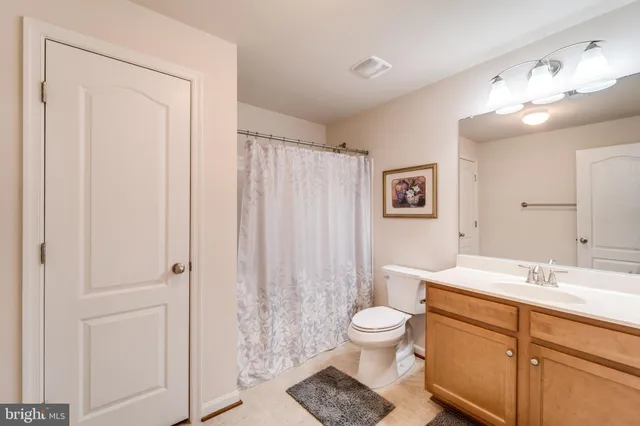 a view of a house with backyard sitting area and garden
