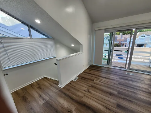 a view of entryway with wooden floor