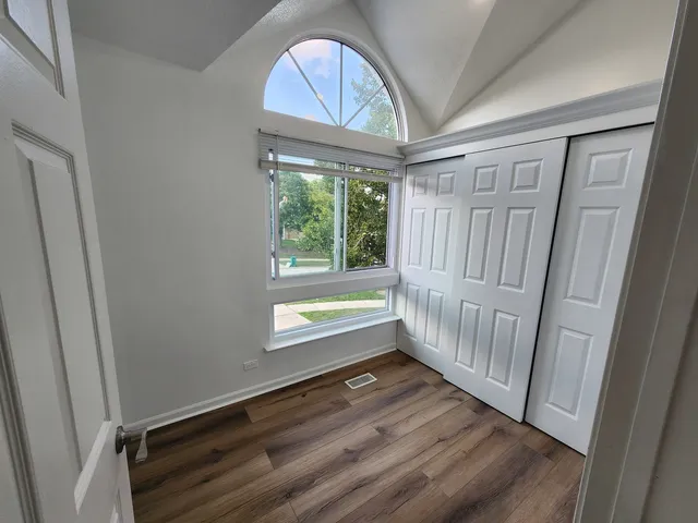 a view of entryway with wooden floor