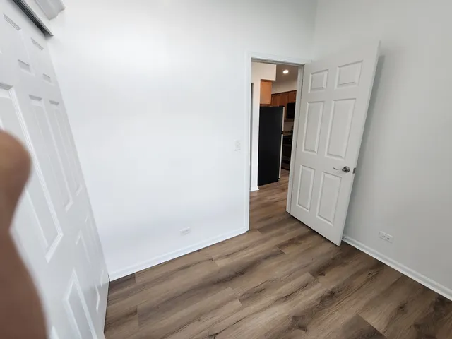 an entryway with wooden floor