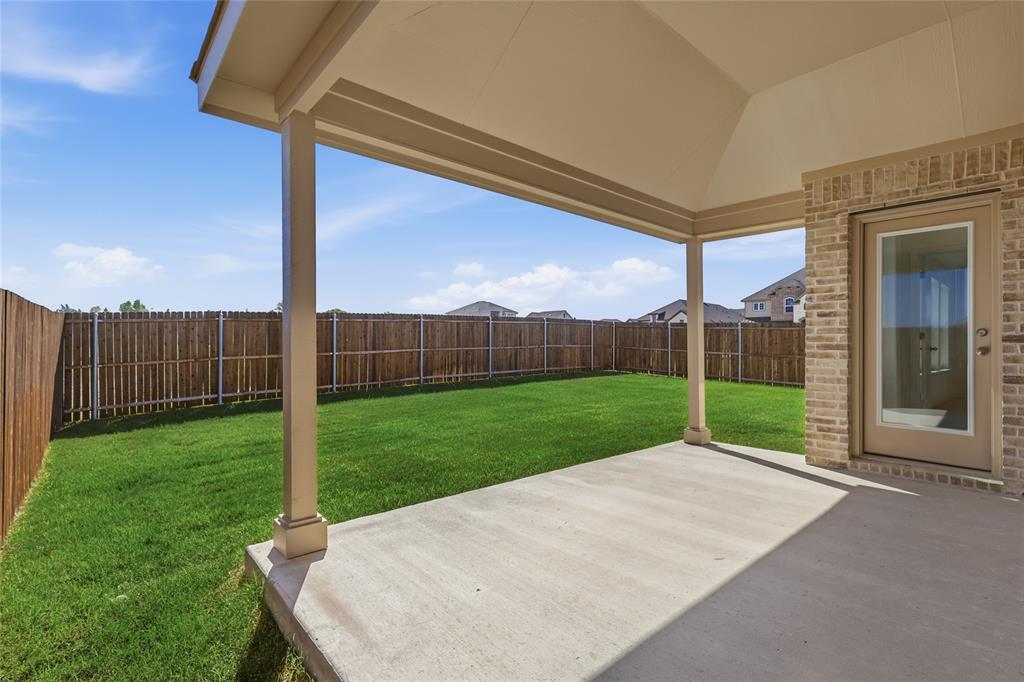 2529 Rivers W Road Anna, TX 75409 - Photo 31 of 40 Covered patio with concrete slab, brick exterior wall, and direct access to a private backyard