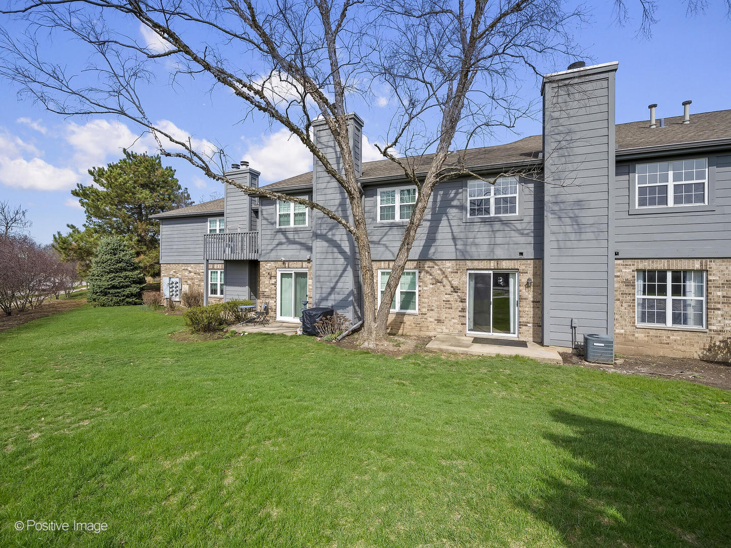11 Foxcroft Road, Unit 115 Naperville, IL 60565 - Photo 15 of 17 a front view of house with yard