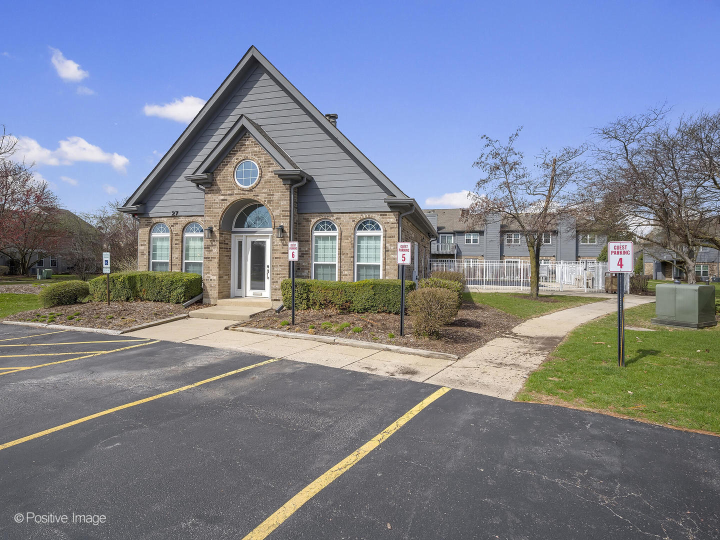 11 Foxcroft Road, Unit 115 Naperville, IL 60565 - Photo 16 of 17 a front view of a house with a yard