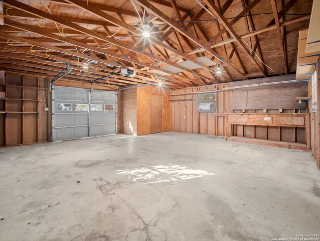 a view of an empty room with wooden walls