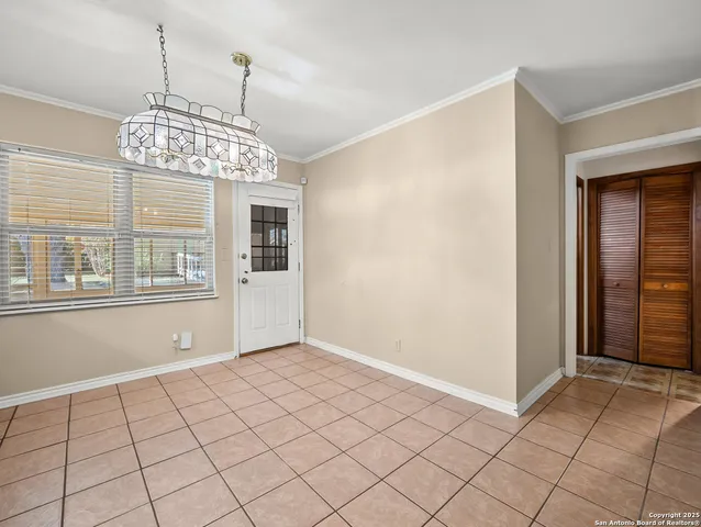a view of a kitchen with microwave and cabinets