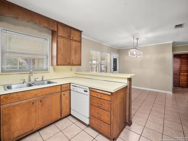 a kitchen with cabinets and appliances