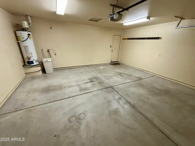 a view of a house with a yard and garage