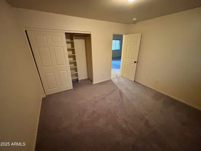 a bathroom with a sink a toilet a mirror and shower