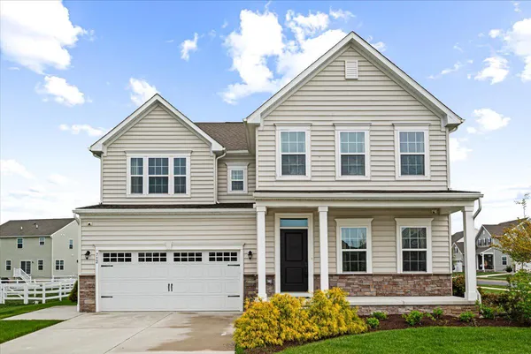 a view of house with yard and entertaining space