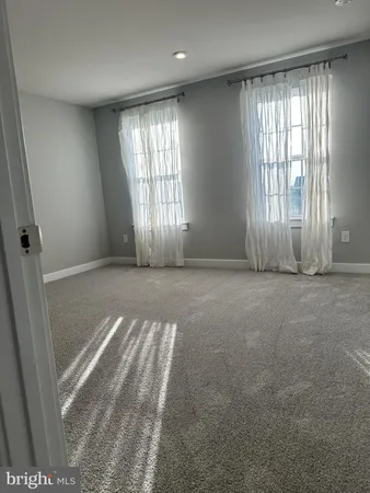 an empty room with windows and yard