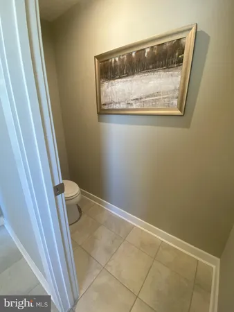 a bathroom with a toilet and a sink