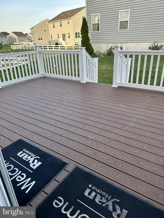a view of a field of grass and trees