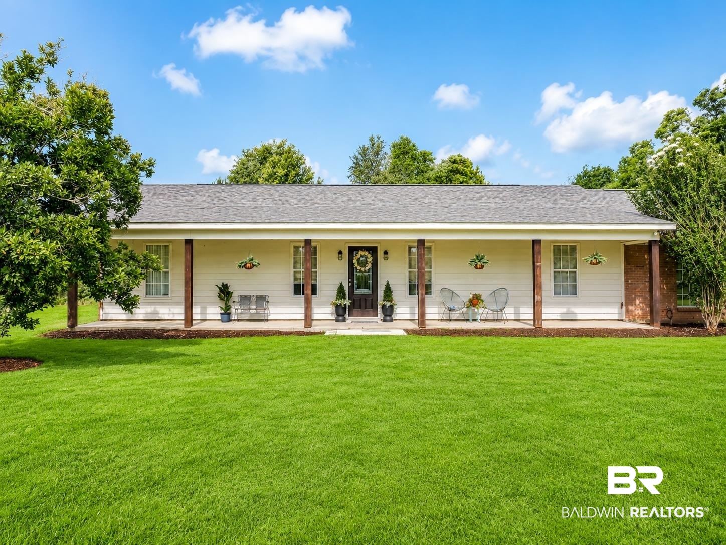 21733 Sedlack Road Silverhill, AL 36576 - Photo 4 of 22 Ranch-style residence featuring a broad covered front porch with wood columns and brick accents
