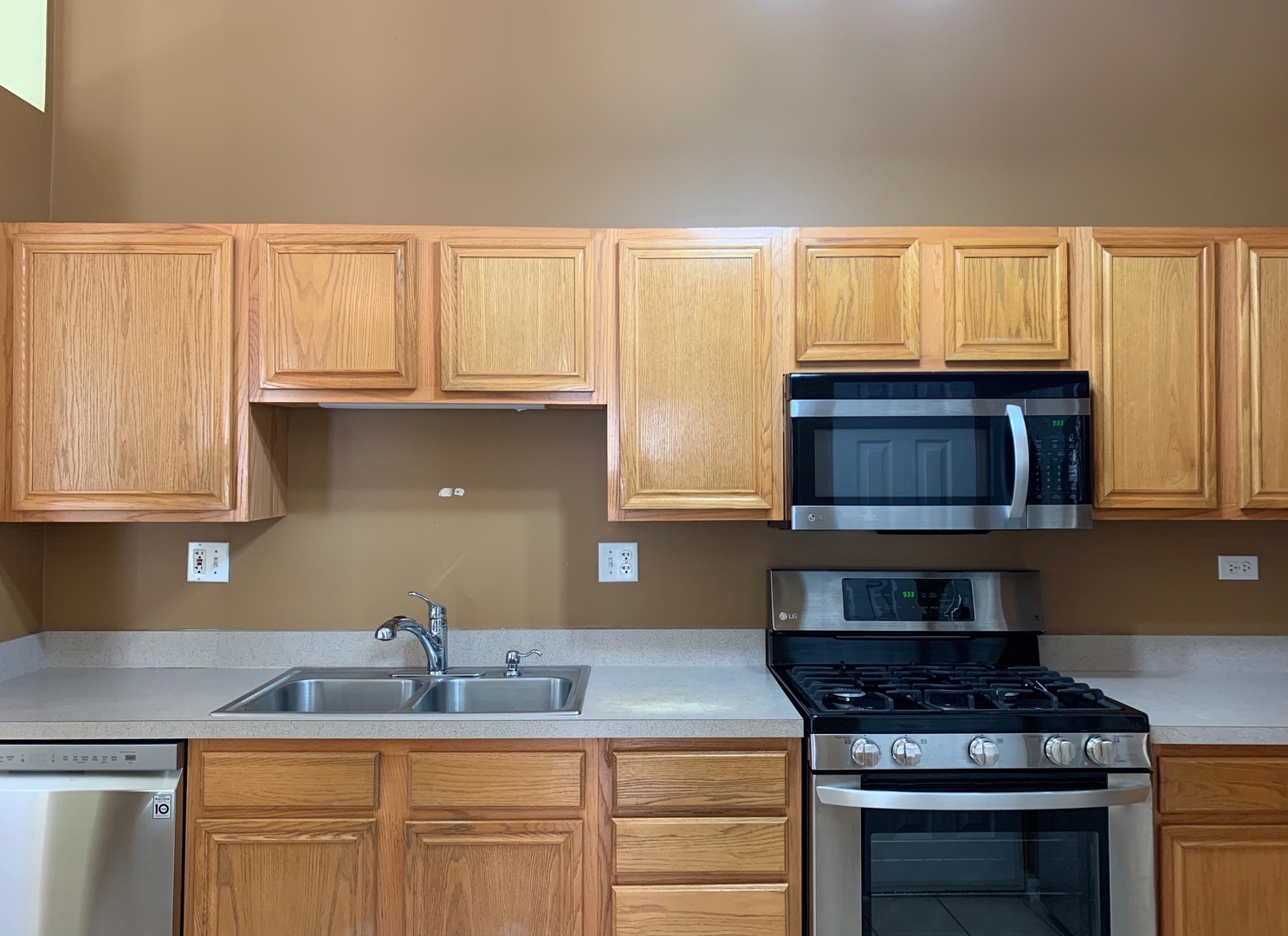 703 Riding Lane, Unit 703 St. Charles, IL 60174 - Photo 11 of 22 a kitchen with granite countertop a sink and cabinets