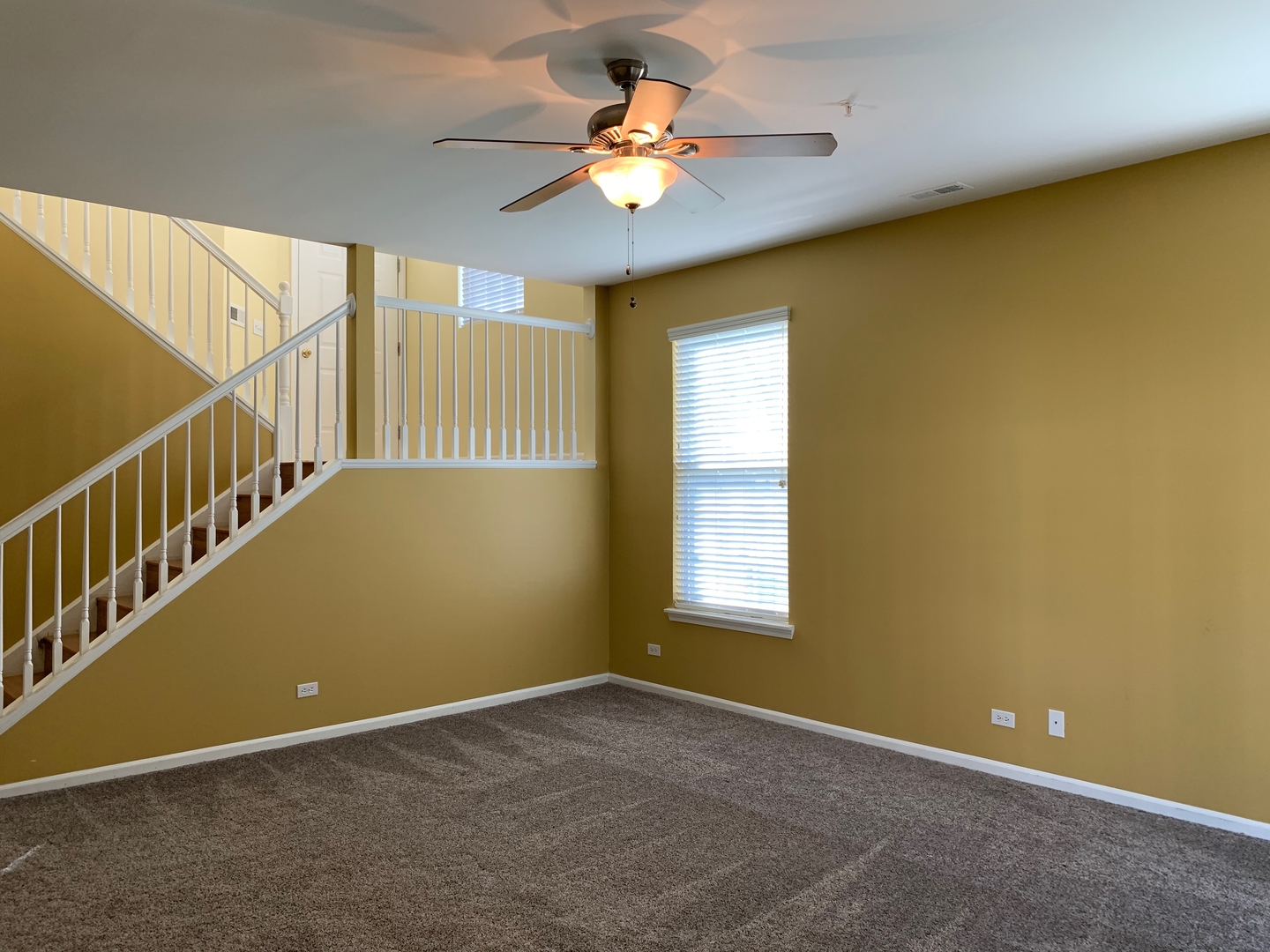 703 Riding Lane, Unit 703 St. Charles, IL 60174 - Photo 13 of 22 a view of an empty room with a window