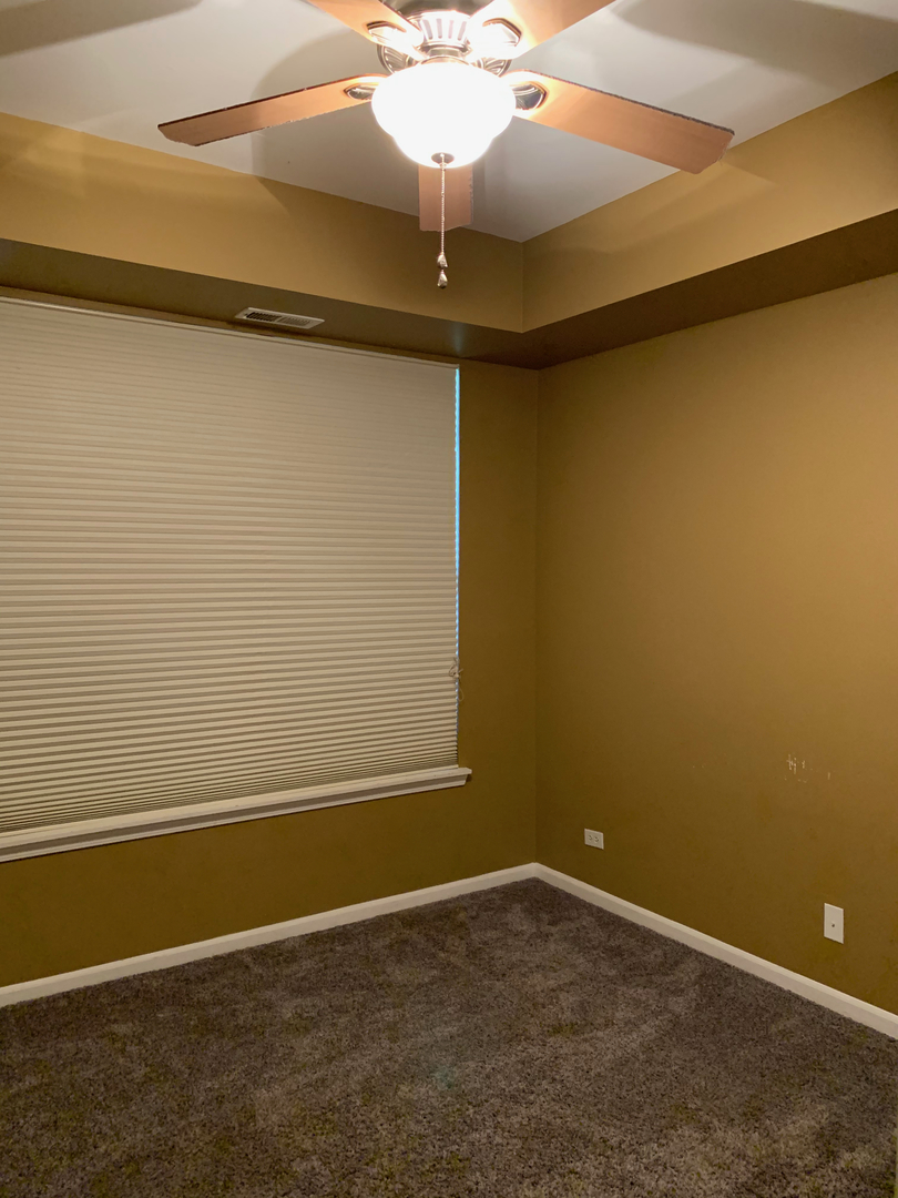703 Riding Lane, Unit 703 St. Charles, IL 60174 - Photo 20 of 22 a view of a small space with a fan