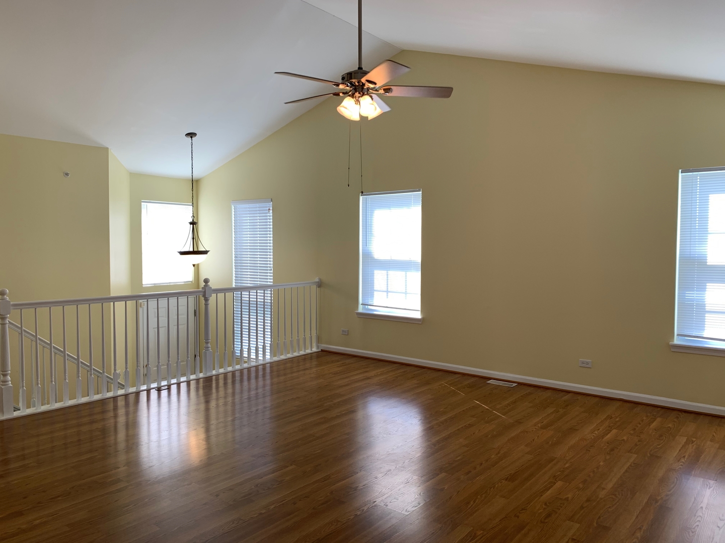 703 Riding Lane, Unit 703 St. Charles, IL 60174 - Photo 6 of 22 a view of a room with wooden floor fan and window
