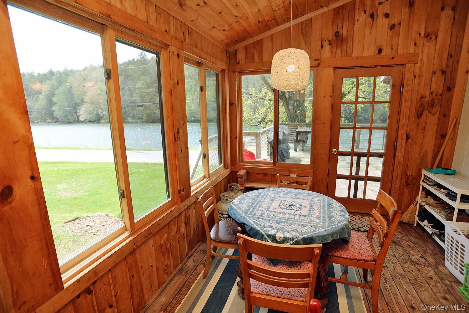 5120 Peas Eddy Road Hancock, NY 13783 - Photo 7 of 37 a view of a dining room with furniture window and wooden floor
