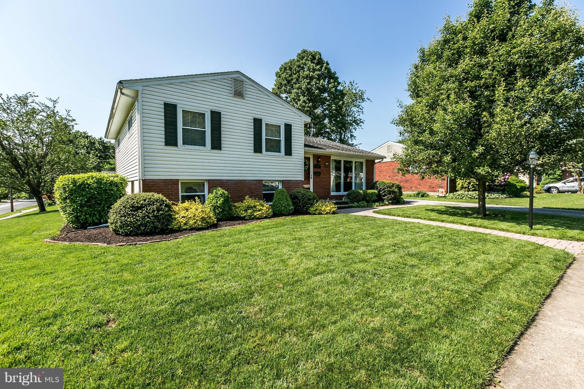 1901 Logwind Road Catonsville, MD 21228 - Photo 1 of 30 a front view of a house with garden