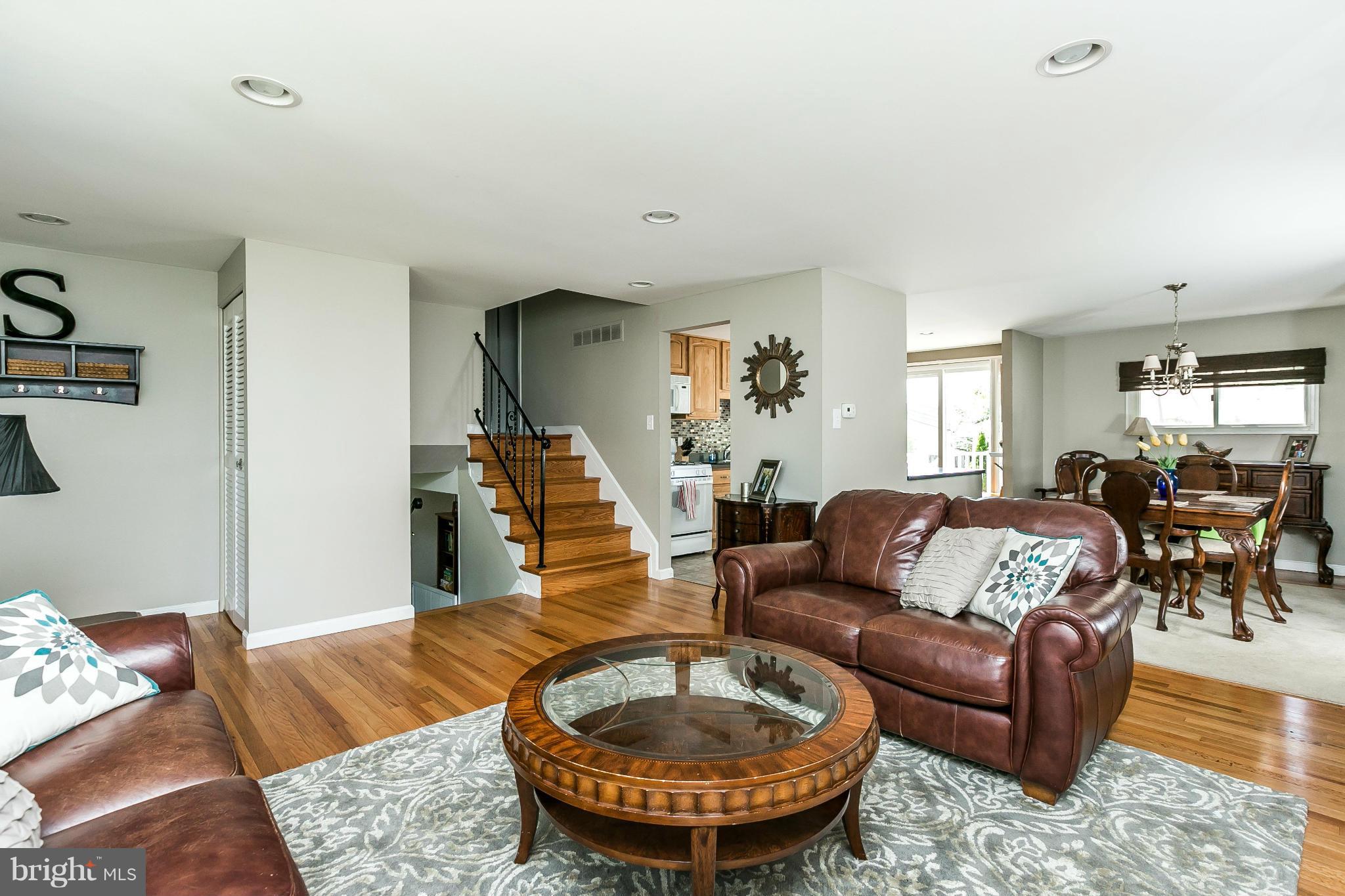 1901 Logwind Road Catonsville, MD 21228 - Photo 5 of 30 a living room with furniture and a dining table