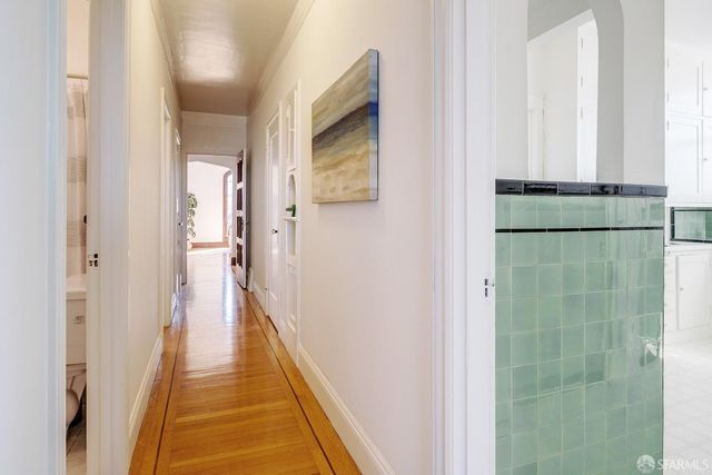 a view of a bathroom from a hallway