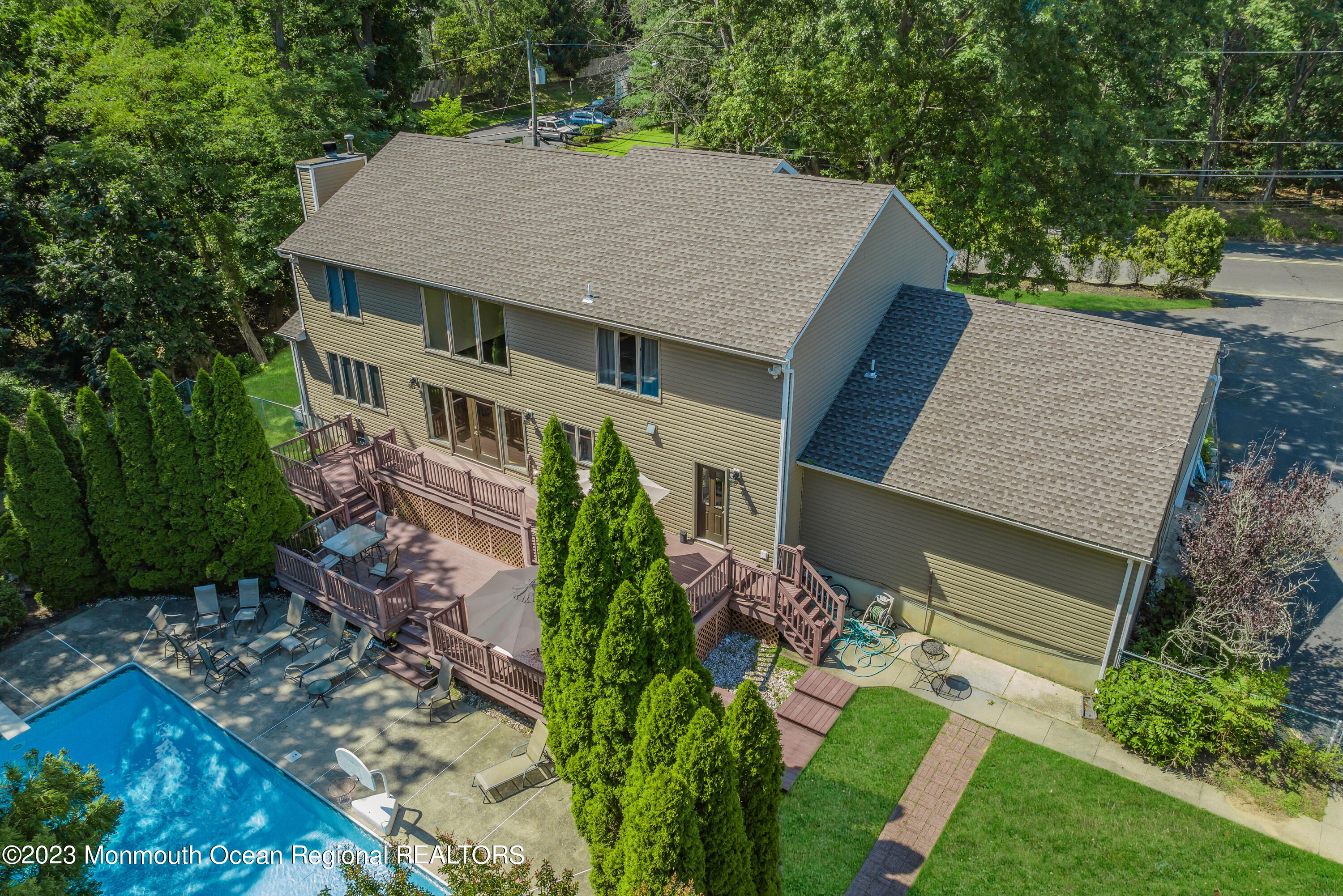 a aerial view of a house with a yard potted plants
