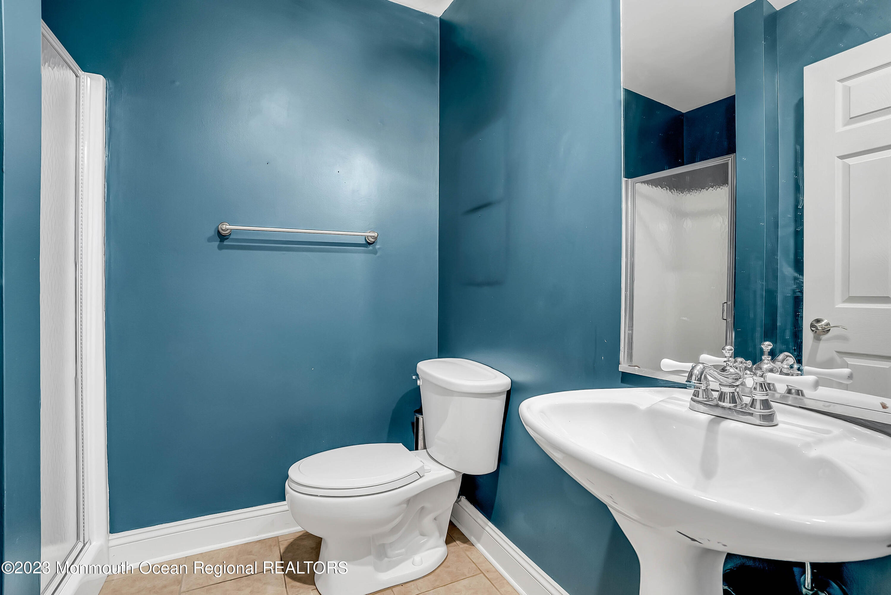 200 Parker Road West Long Branch, NJ 07764 - Photo 27 of 50 a bathroom with a sink a toilet and mirror
