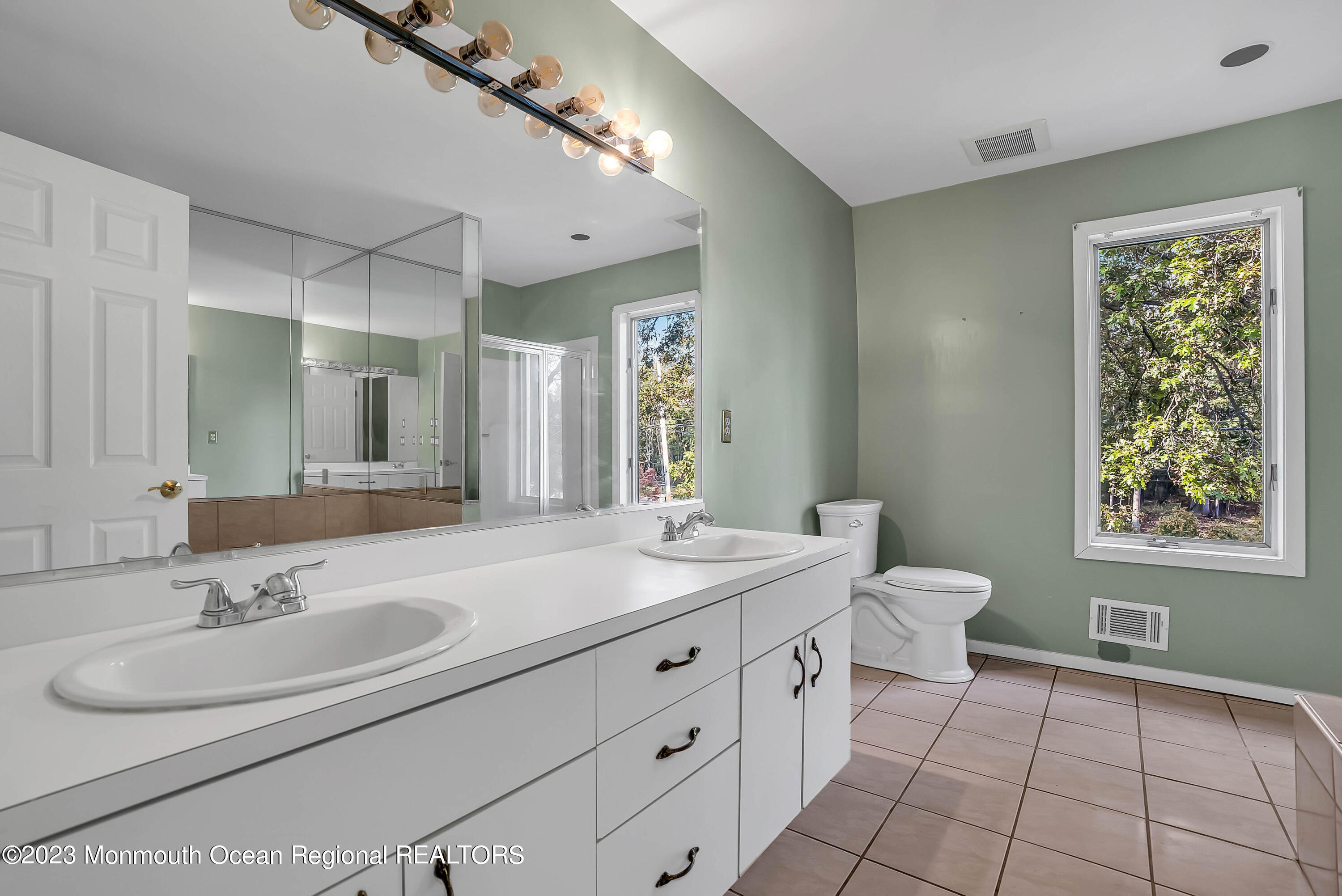 200 Parker Road West Long Branch, NJ 07764 - Photo 34 of 50 a bathroom with a sink double vanity and a toilet