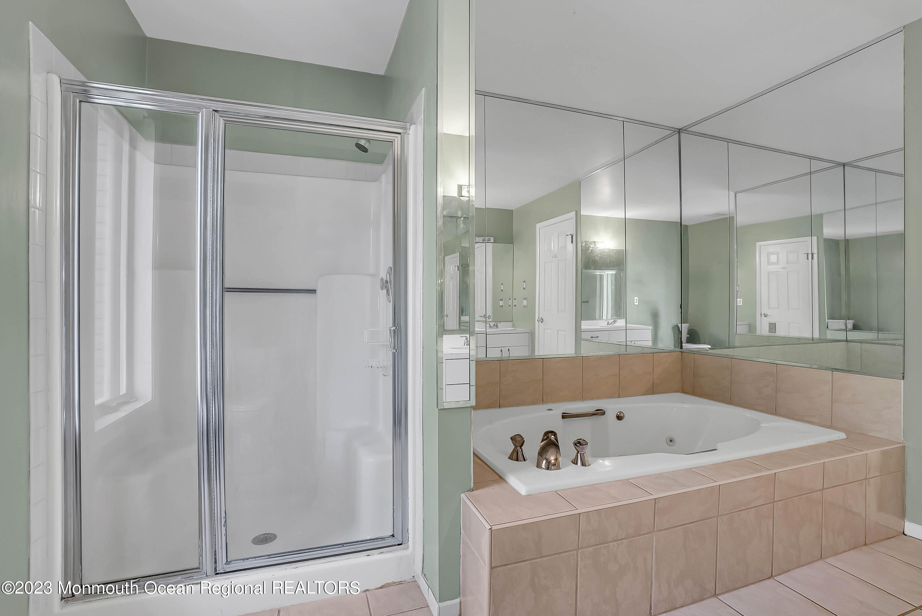 200 Parker Road West Long Branch, NJ 07764 - Photo 35 of 50 a bathroom with a tub a sink and a mirror