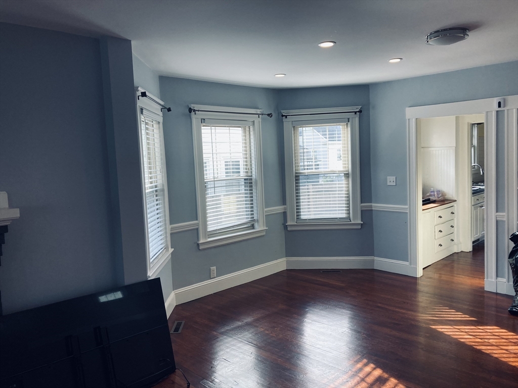 42 Alicia Road, Unit 1 Boston, MA 02124 - Photo 12 of 19 a view of an empty room with wooden floor and a window