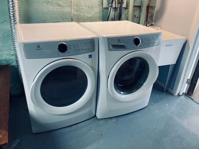 a utility room with dryer and washer