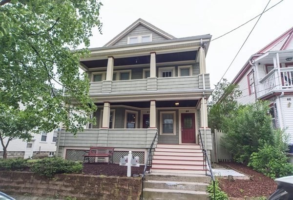 42 Alicia Road, Unit 1 Boston, MA 02124 - Photo 2 of 19 a front view of a house with a yard