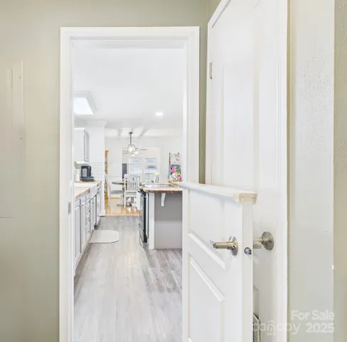 a view of a kitchen and an entryway