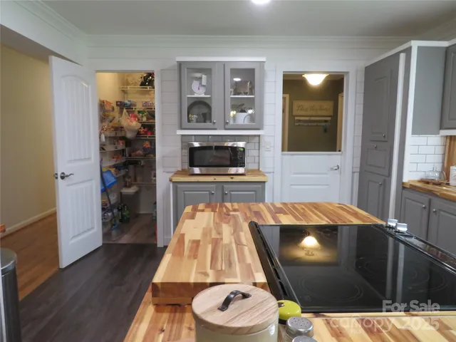 a room with wooden floor and furniture