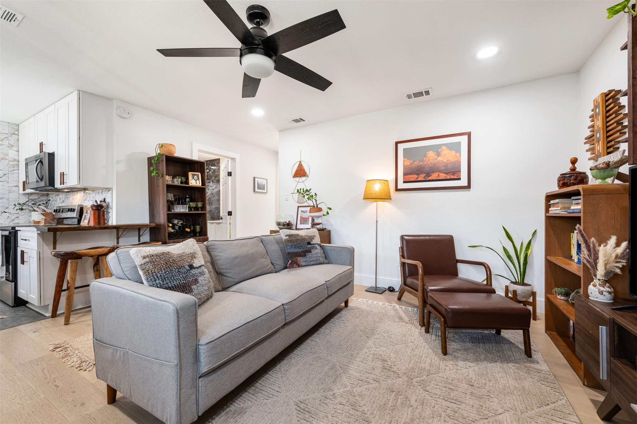 1616 Webberville Road, Unit A Austin, TX 78721 - Photo 17 of 35 Living room featuring light wood-style flooring, recessed lighting, and ceiling fan