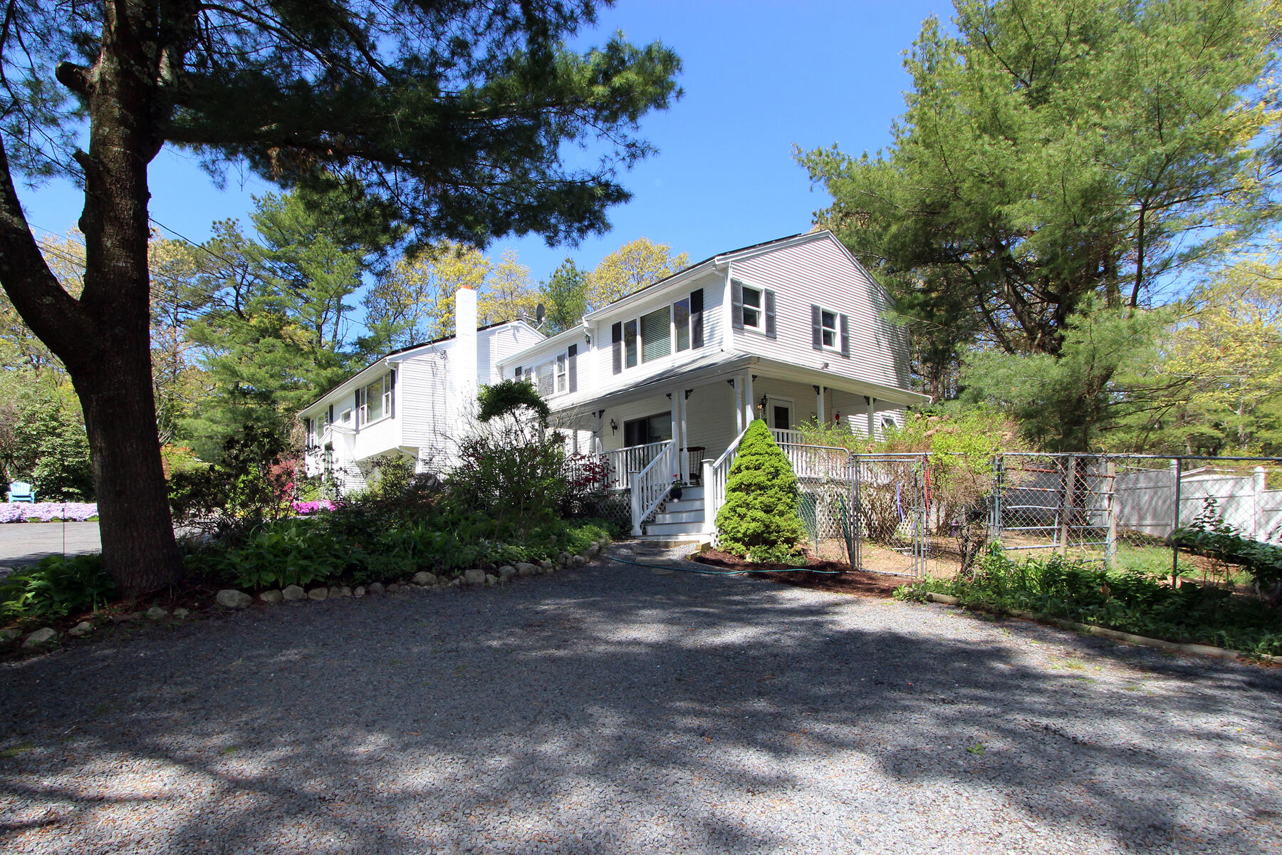 46 Foster Howard Road Pocasset, MA 02559 - Photo 3 of 70 a front view of a house with a yard