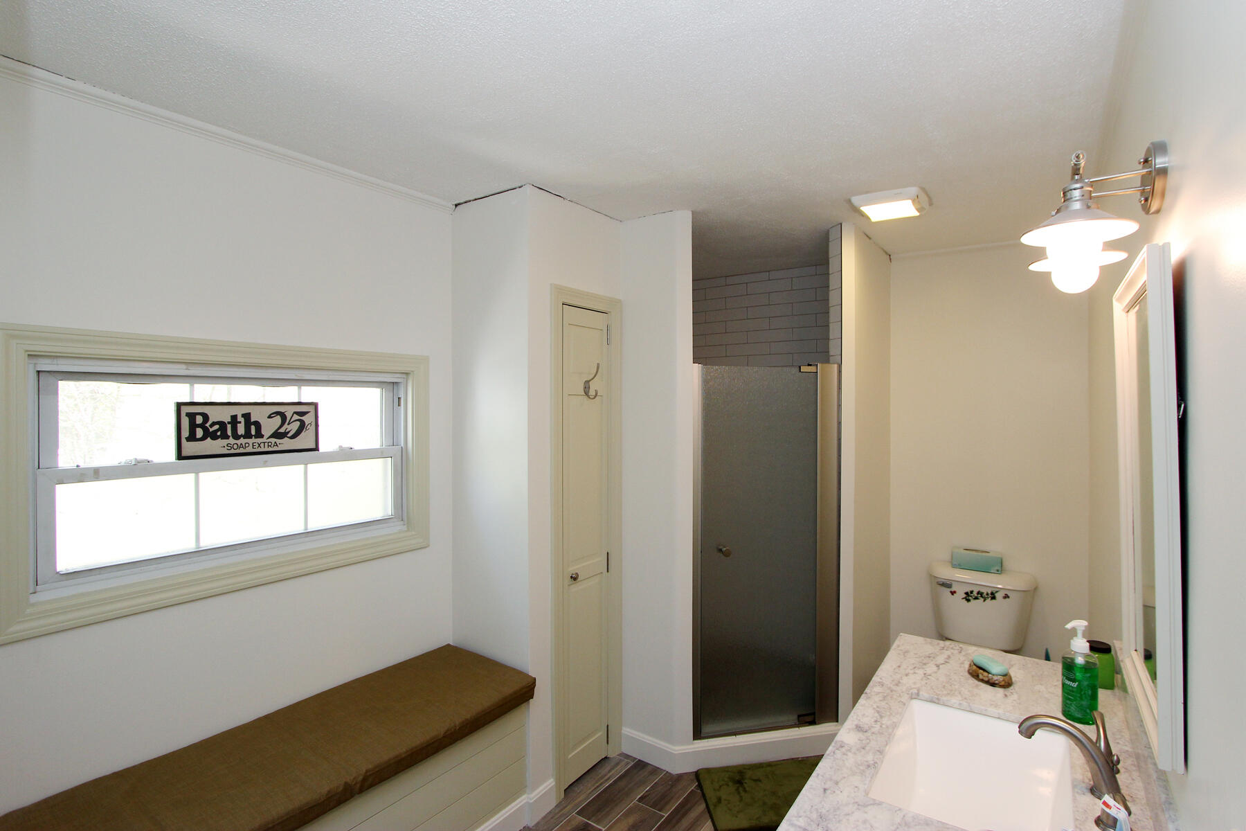 46 Foster Howard Road Pocasset, MA 02559 - Photo 34 of 70 a bathroom with a sink mirror and toilet