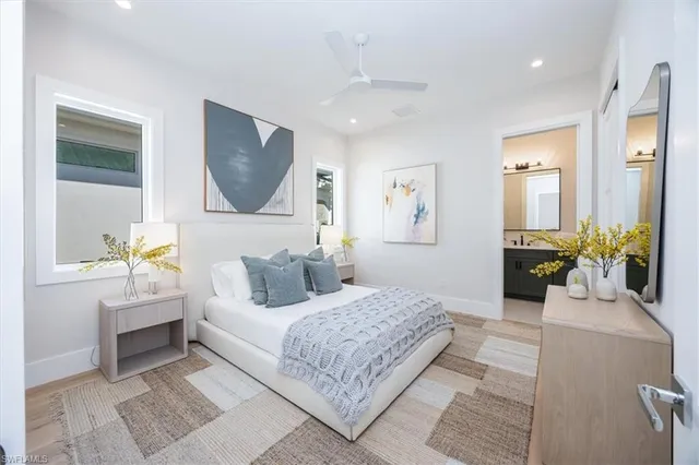 a bedroom with a large bed and a couch